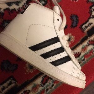 White adidas with black stripes